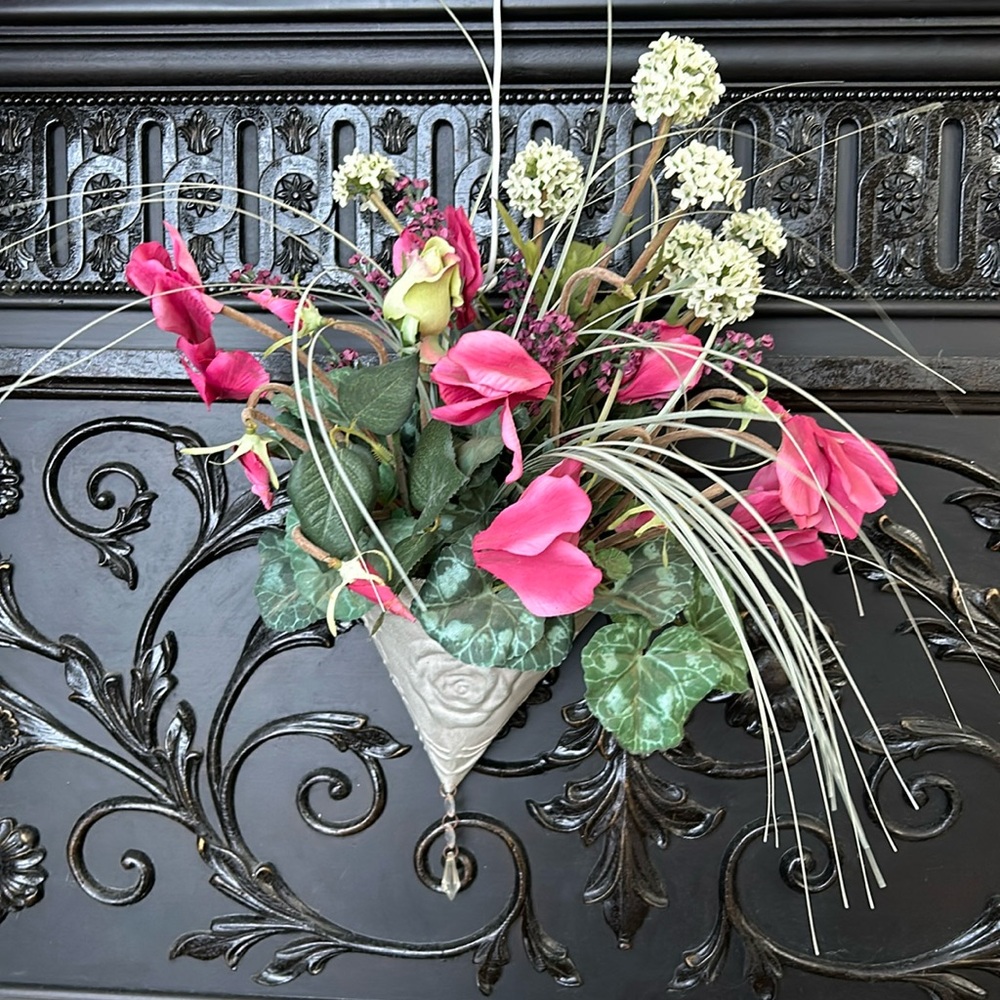 Hanging wall sconce with beautiful silk flowers and jeweled detail